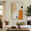 Warm abstract painting with ochre shapes, black linework, and textured ivory ground