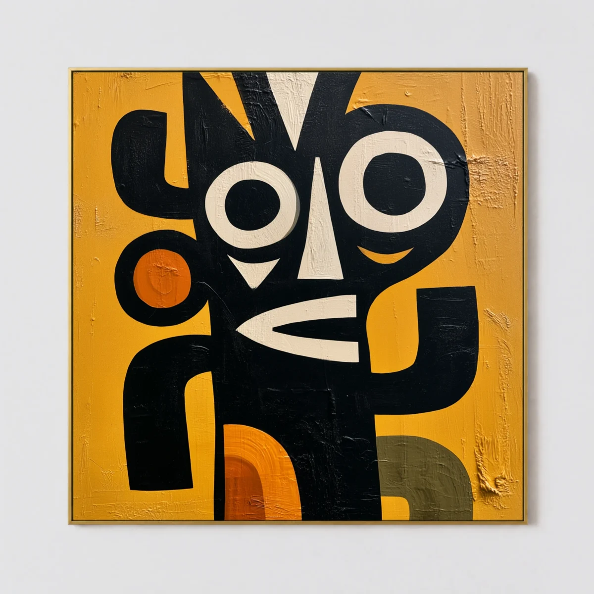 Black abstract face with ivory eyes, white nose, and orange triangle on ochre canvas